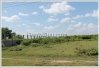 Land by Mekong with wall fence about 18km from city center