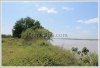 Land by Mekong with wall fence about 18km from city center