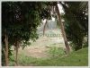 New Lao classic house by Namkan River and frontage next to pave road in city of Luangprabang