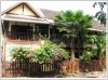 New Lao classic house by Namkan River and frontage next to pave road in city of Luangprabang