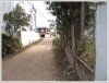 Land with an wooden house on quite large land for sale