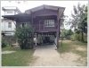 Land with an wooden house on quite large land for sale
