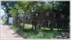 Land with an wooden house on quite large land for sale