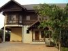 Lao modern house near rice paddy